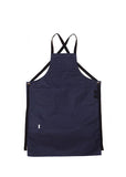  Navy canvas apron with multiple pockets and adjustable crossback straps, laid flat on a white background