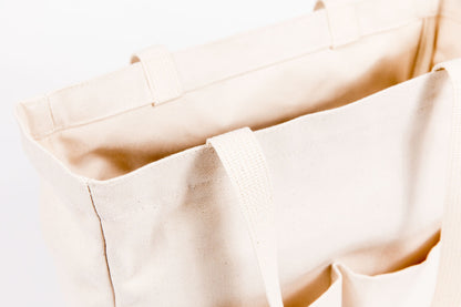  Close-up of natural canvas fabric and handles on the Utility Carryall tote