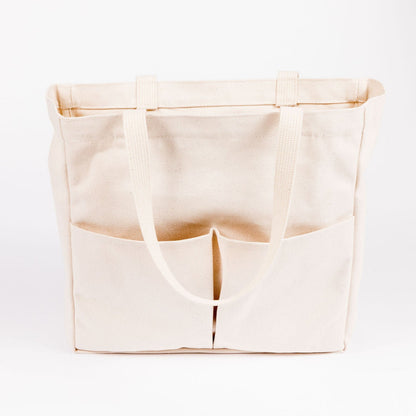 Natural canvas Utility Carryall tote with front pockets, shown against a white background