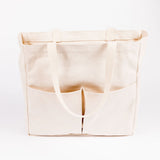 Natural canvas Utility Carryall tote with front pockets, shown against a white background