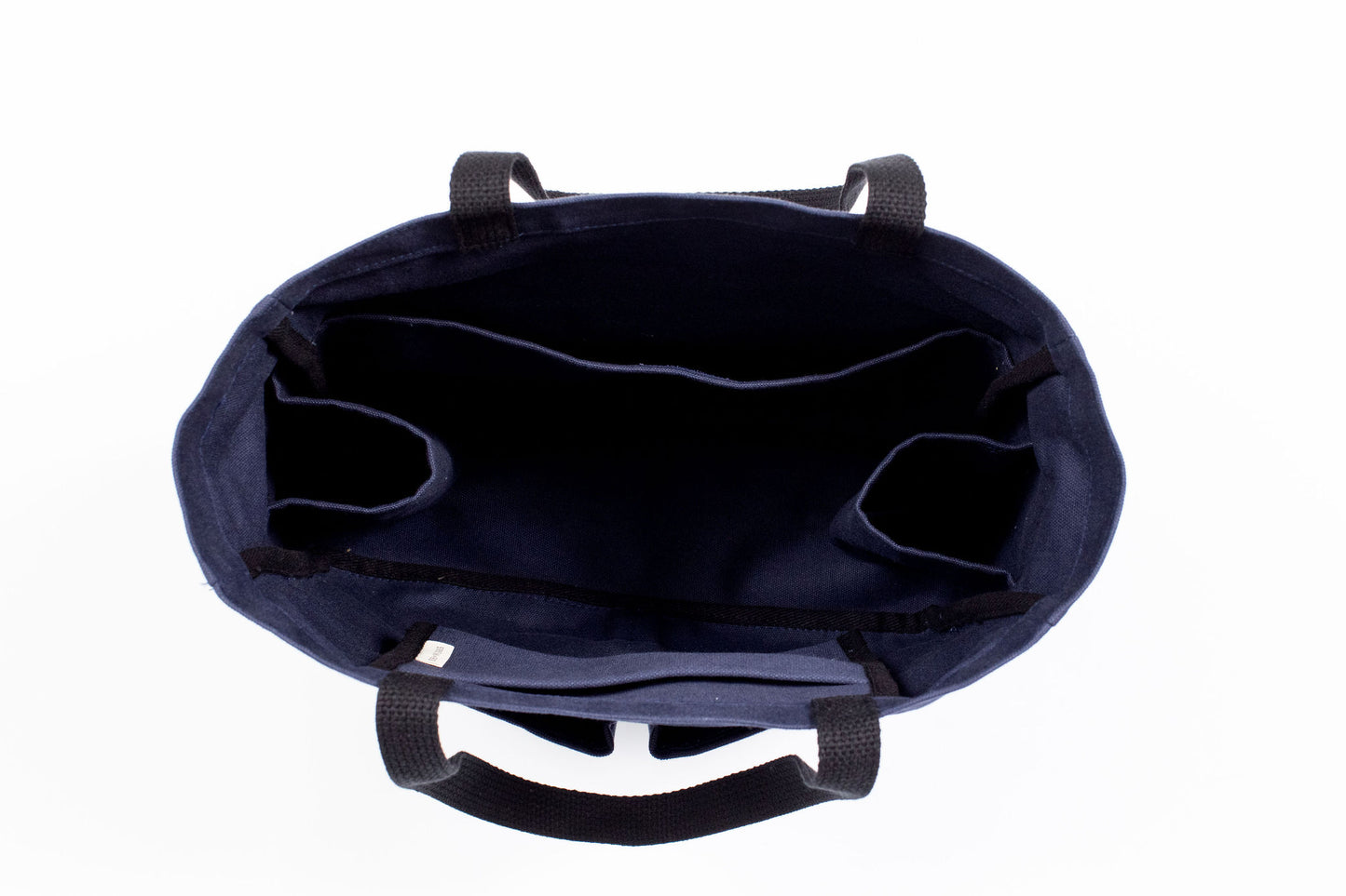 Canvas Utility Carryall tote in navy, viewed from above showing interior pockets and center divider