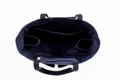 Canvas Utility Carryall tote in navy, viewed from above showing interior pockets and center divider