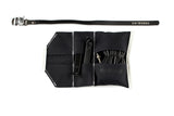  Open black canvas Sojourner tool roll with black leather trim, showing tire levers and a spare tube in the pockets