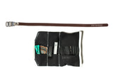  Open black canvas Sojourner tool roll with brown leather strap, showing tire levers, a patch kit, and a spare tube in the pockets